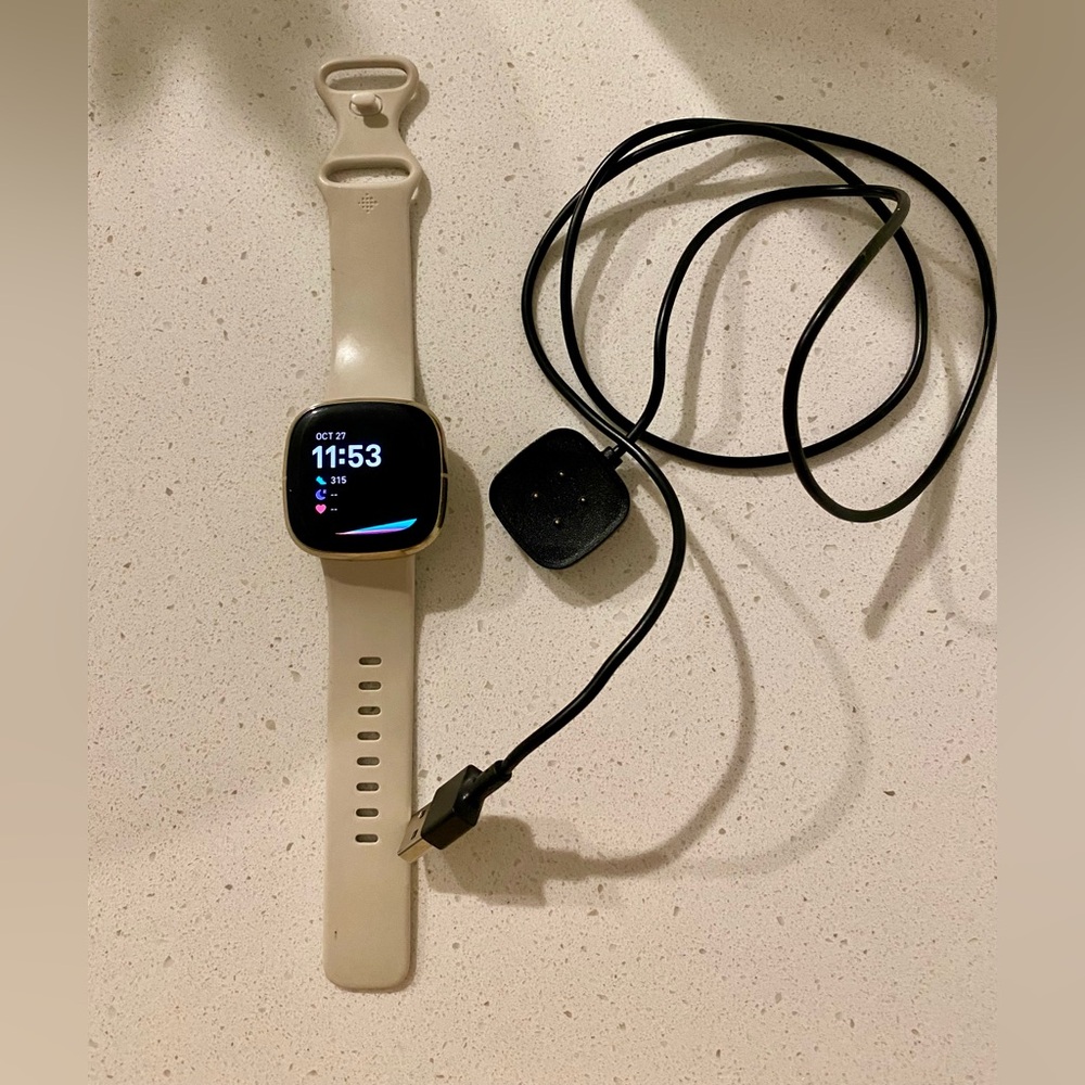 Fitbit Smartwatch with Beige Band